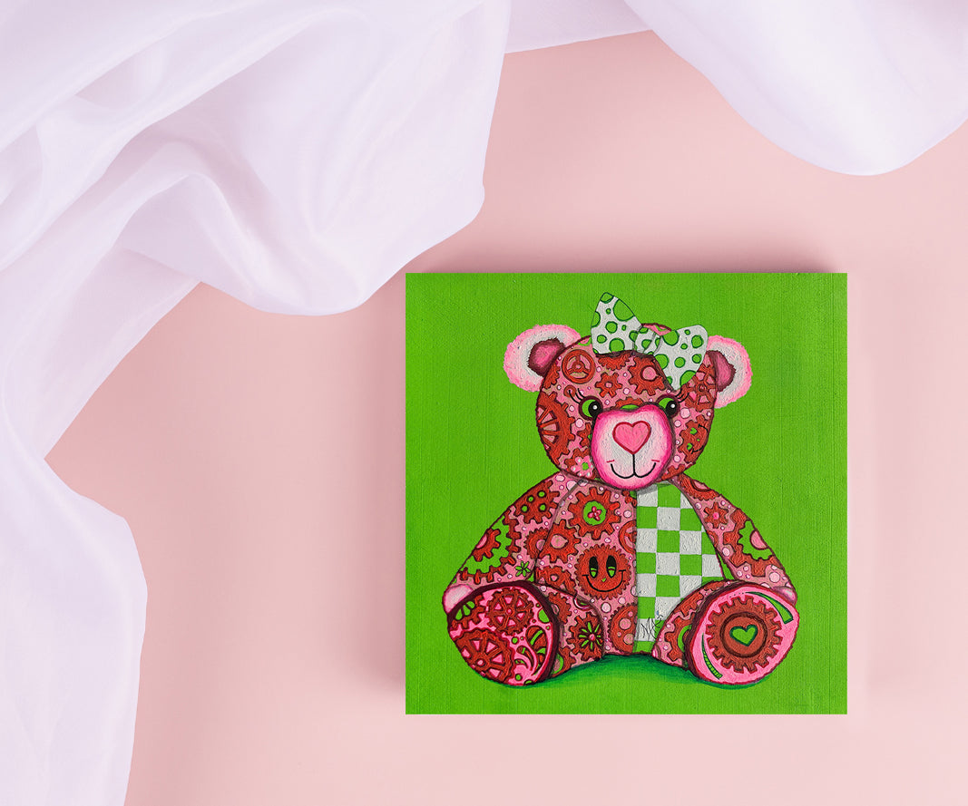 Meet "Lovey," the newest member of the GEAR BEAR family in the Doodle Gears collection! Lovey is a heartwarming bear painted in soft pinks, greens, & whites, covered in gears that turn together to symbolize love and hope. Just like the gears of life keep us moving forward, Lovey reminds us that love is the powerful force that makes the world go round. 

Whether you're searching for a little extra love or want to spread joy, Lovey is here to inspire &  uplift. Original Teddy Bear Nursery Pop Art Painting